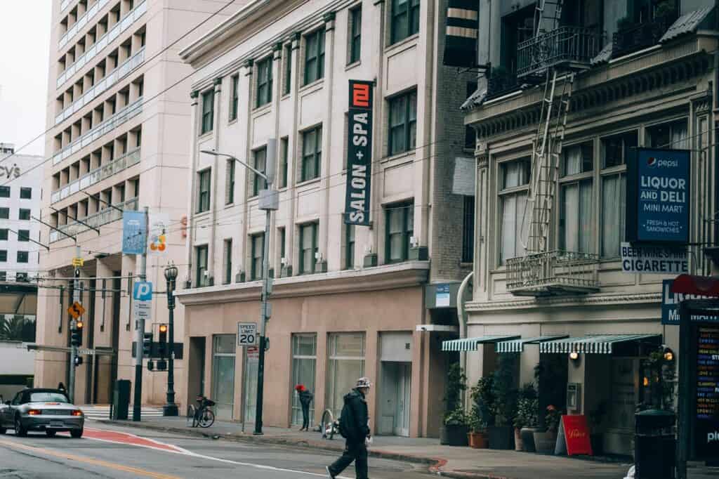 A big street with buildings full of shops