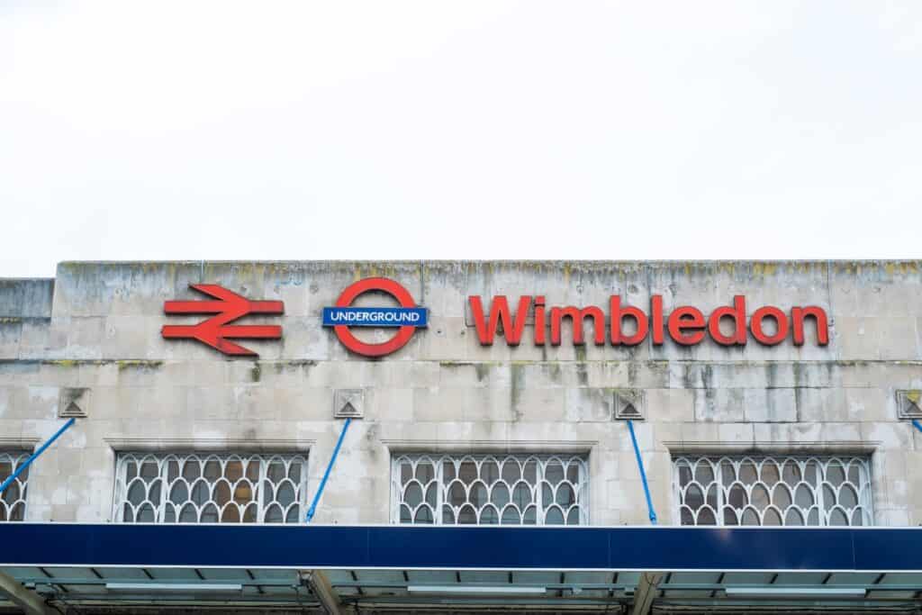 Outside of the Wimbledon Underground Station in the concept of 'how to use Wimbledon's public transport'.