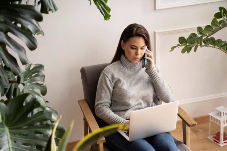 A woman speaking with Man and Van on the phone in the concept of 'How to Get a Quote for a Man and Van Service'.