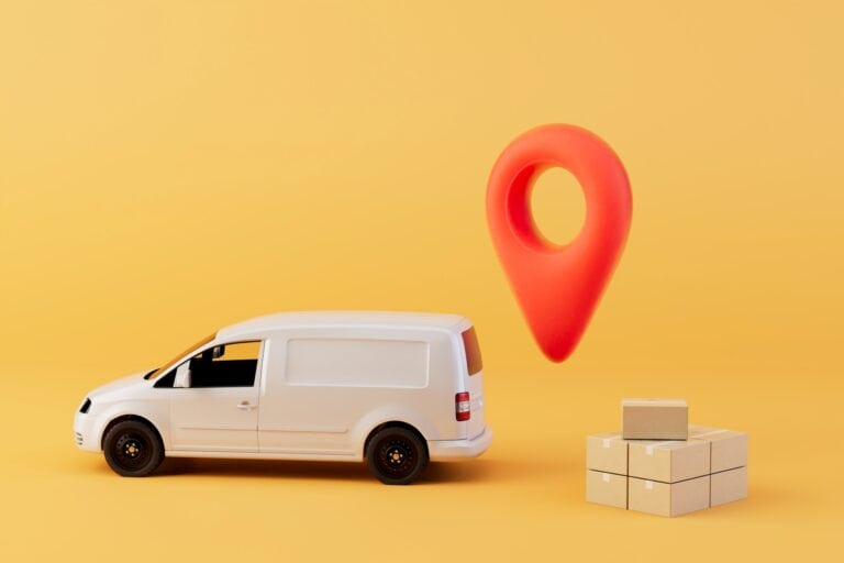 A mover's van toy with boxes and locator pin in the concept of 'Can You Use a Man and Van Service for Long-Distance Moves'.